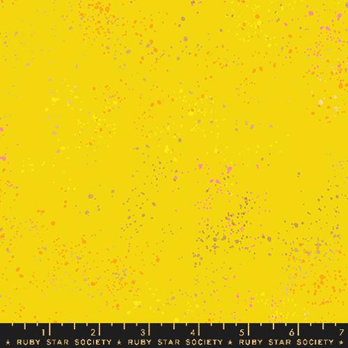 Yellow fabric with small colorful specks and a Ruby Star Society label at the bottom.