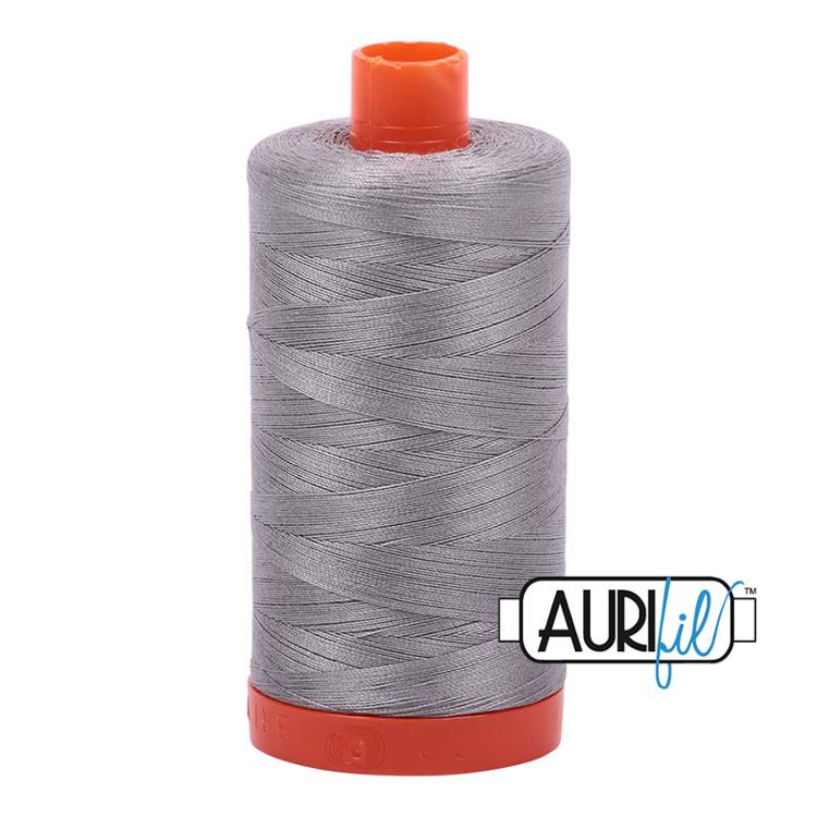 Spool of gray thread with red ends on a white background, featuring the Aurifil logo.