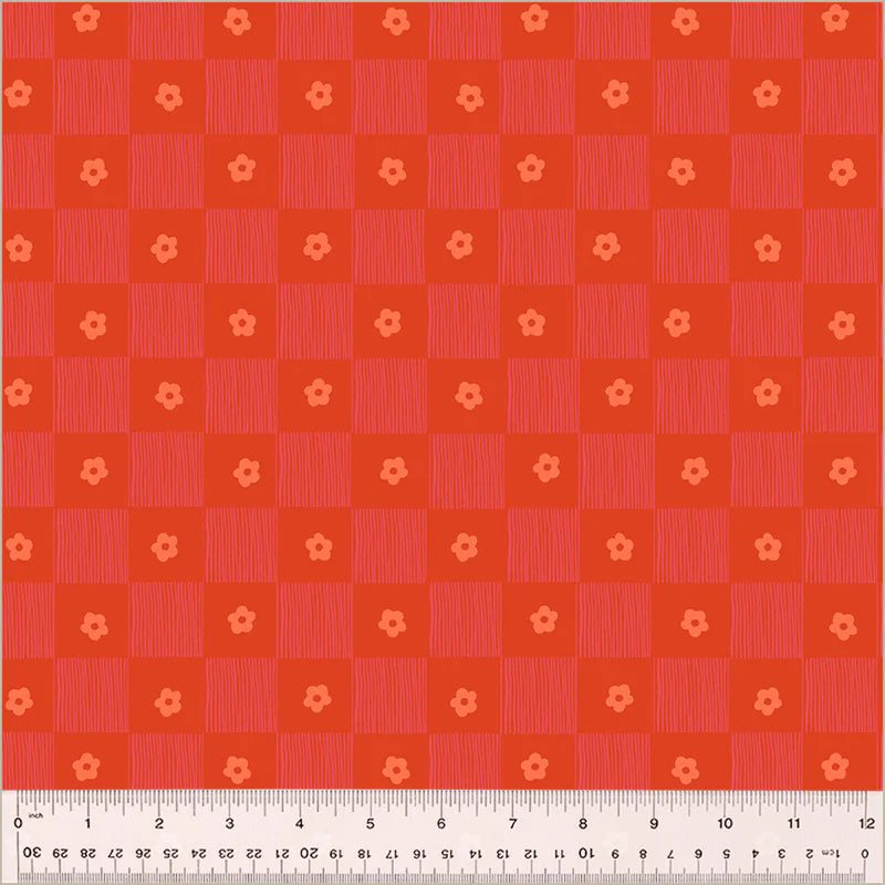 Red checkered pattern with small floral shapes on a red background, measured with a ruler at the bottom.