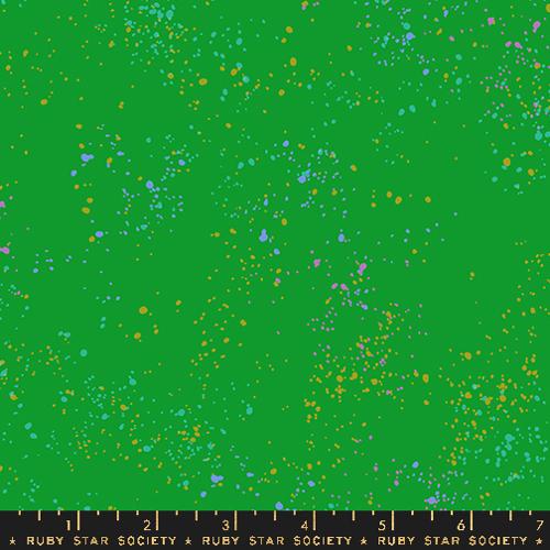 Green fabric with colorful speckles and a ruler at the bottom, featuring Ruby Star Society label.